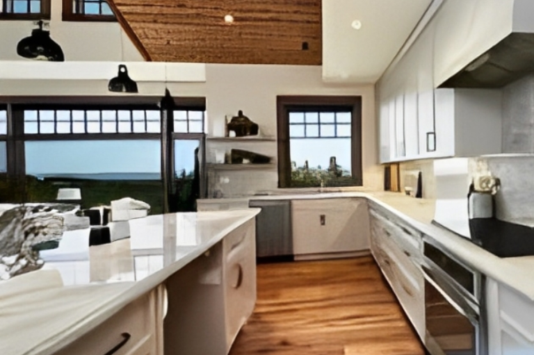 Modern kitchen with white cabinets and island.
