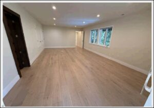 Empty long room with hardwood floors