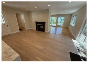 Bright living room with hardwood floors and fireplace