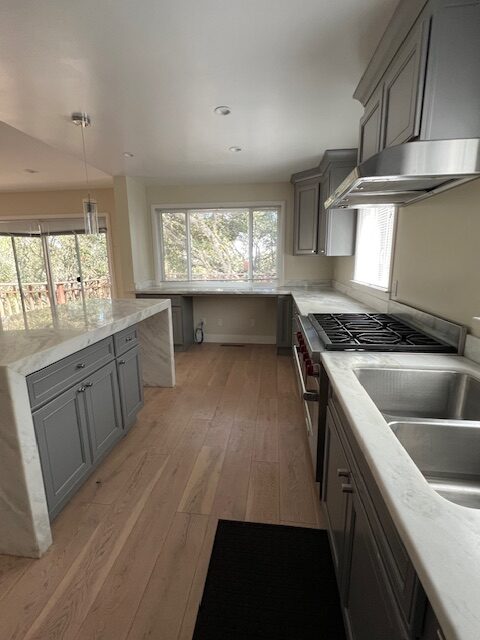 Modern gray kitchen with marble countertops