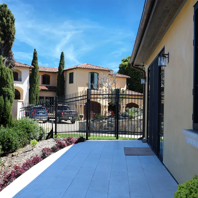 Mediterranean-style villa with garden and pathway.